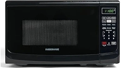 The image shows a compact microwave oven suitable for a truck driver's cab.