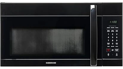 The image shows a stylish kitchen with a top-rated microwave mounted above a stovetop.